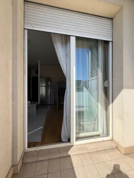 View from the terrace through the balcony door into the interior of the apartment. - image 8
