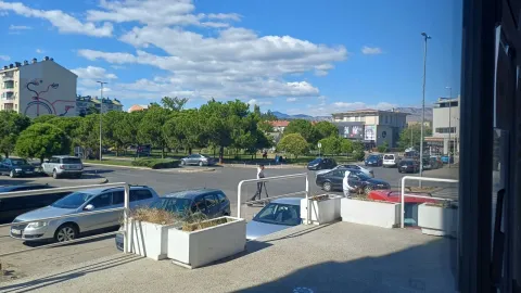 View from the terrace overlooking the city parking lot and surrounding streets. - image 9