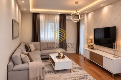 Modern and bright living room with a sectional sofa and television. - image 2
