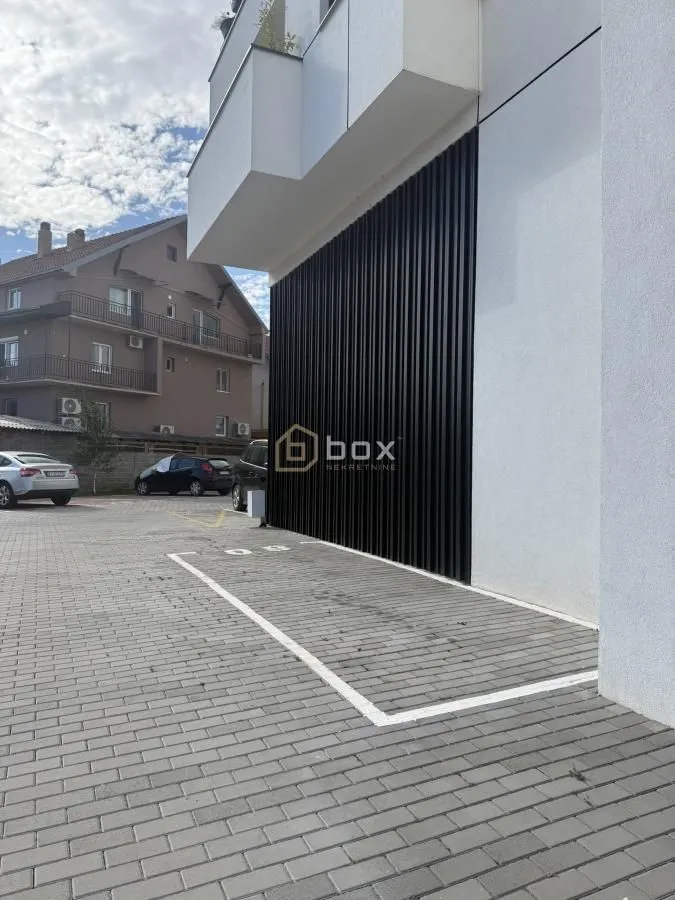 View of the parking area and building exterior.