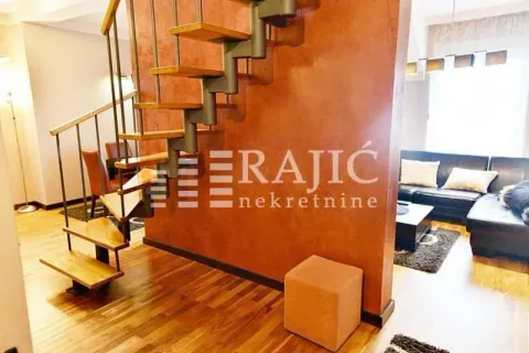 Interior of the living room with stairs and wooden flooring. - image 4