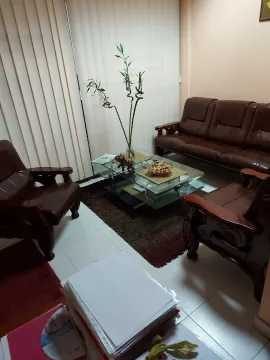 Living room featuring leather furniture and a glass coffee table. - image 2