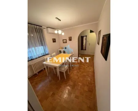 Dining room with table, chairs, and parquet flooring. - image 5