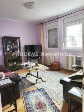 Living room with a sofa set, television, and coffee table. - image 3