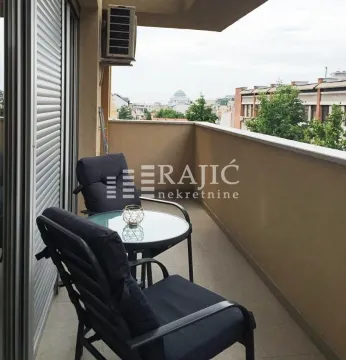 Furnished terrace with seating furniture and a city view. - image 15