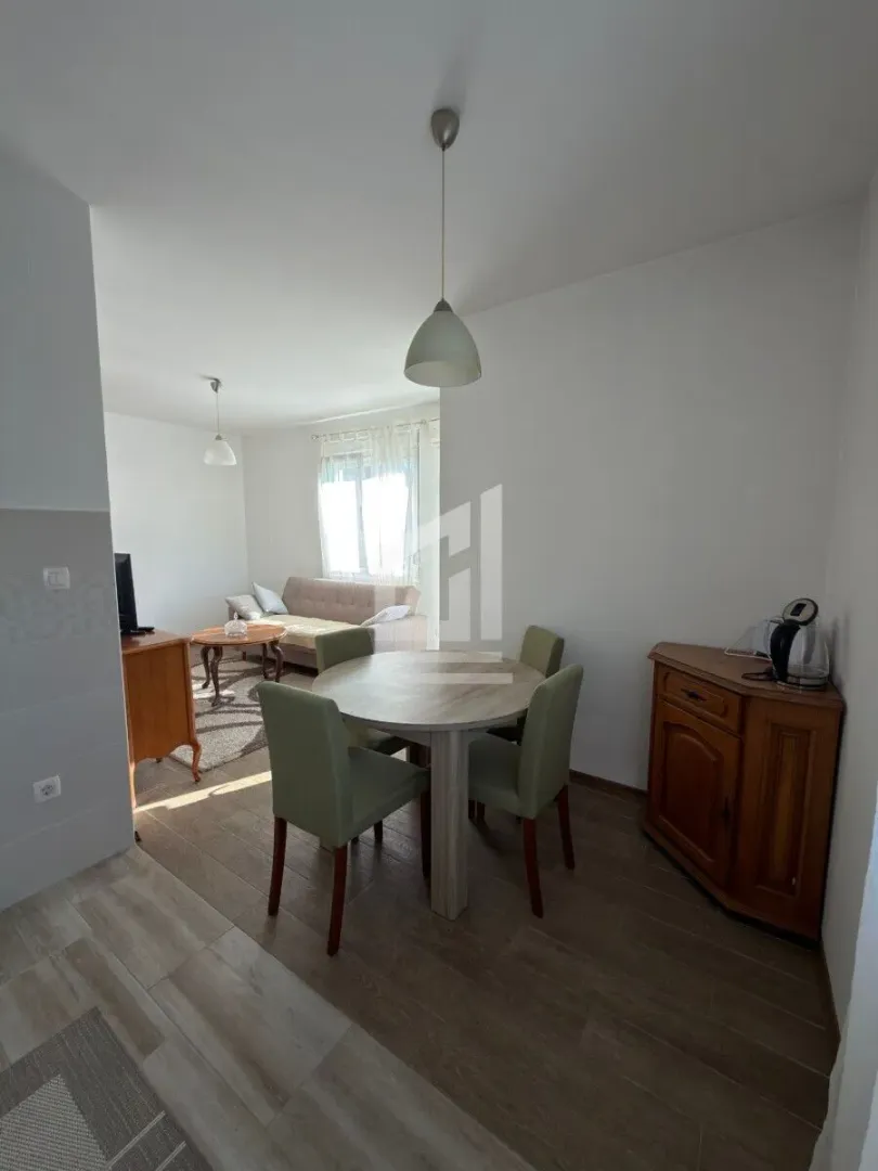 Living room with a dining table and chairs.