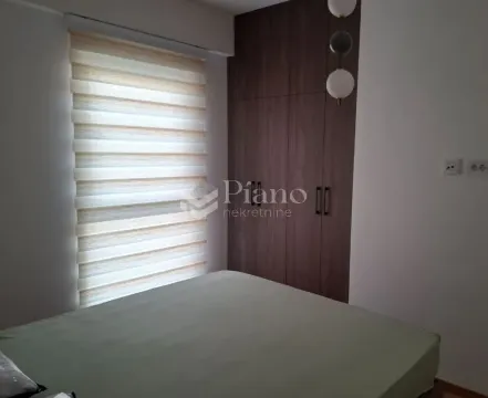 Bedroom with a bed, fitted wardrobe and a window. - image 4