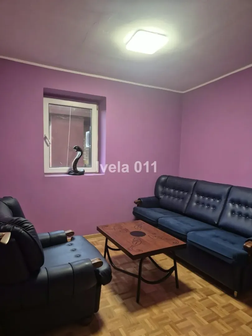 Living room with a sofa set and a coffee table.