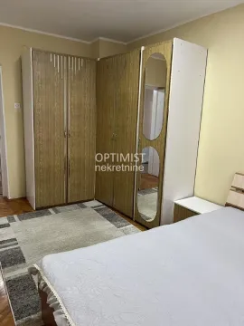 Furnished bedroom with a double bed and large wardrobes. - image 5