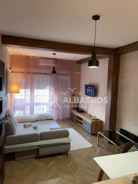 Living room with sofa, TV and dining table. - image 3