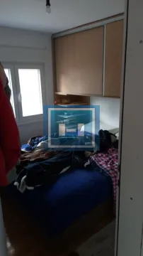 Small bedroom with a bed and a built-in wardrobe. - image 12