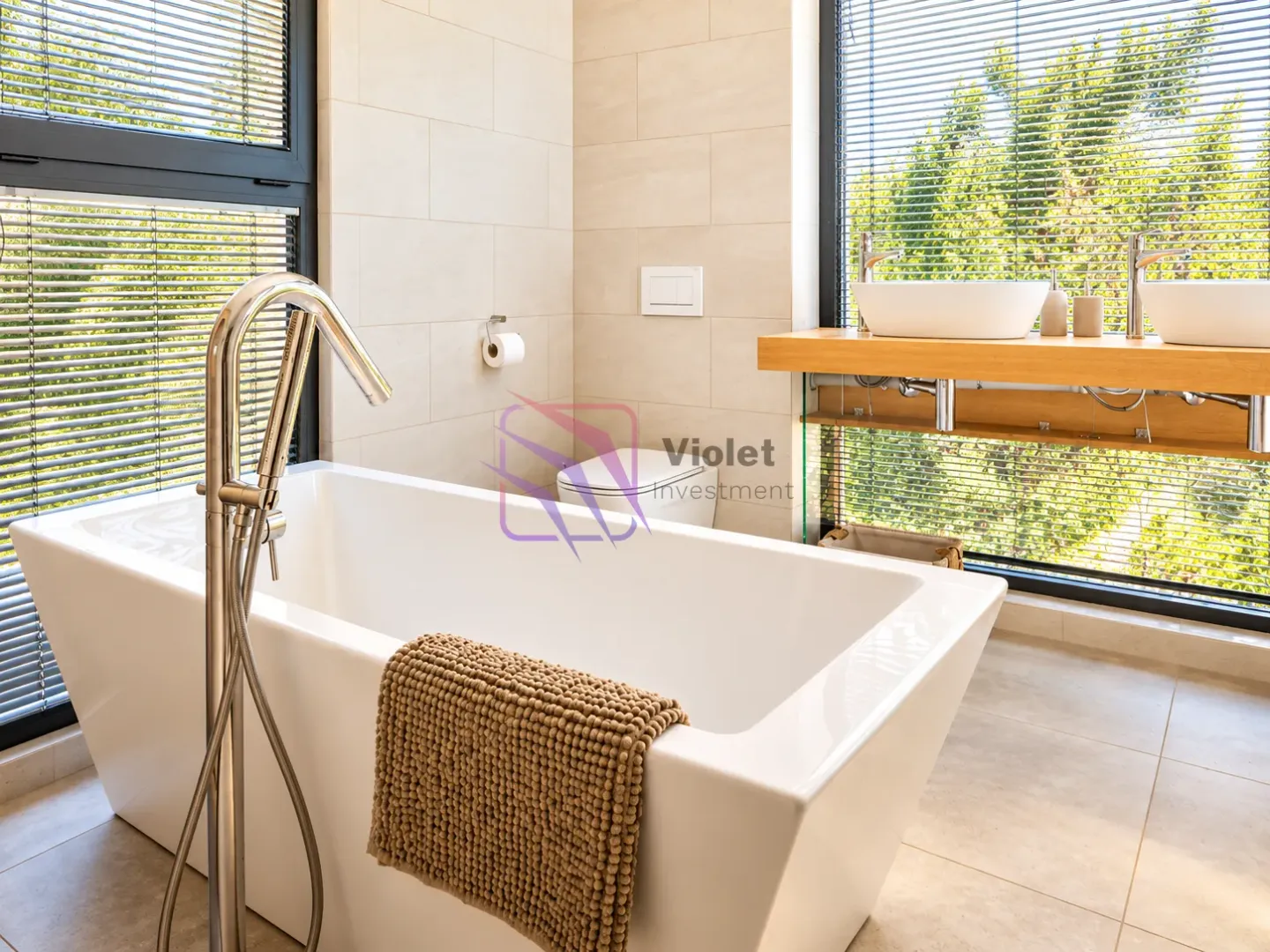 Modern bathroom with a freestanding bathtub, double sinks, and large windows.