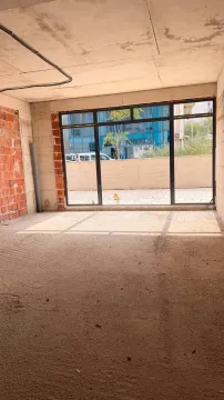 Unfinished room in grey phase with a large window. - image 4