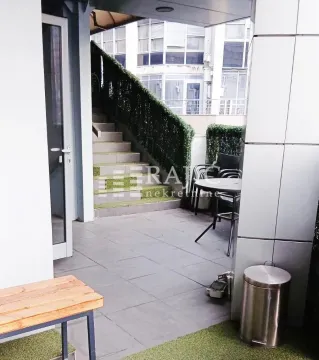 Terrace with seating furniture and stairs. - image 2
