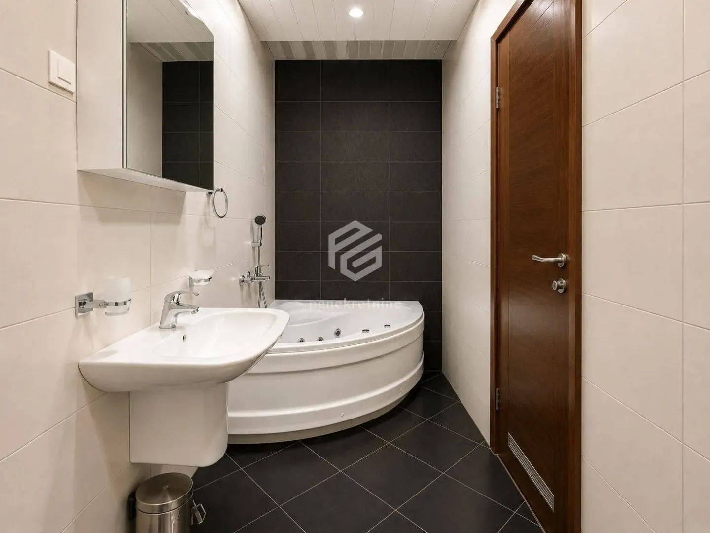 Modern bathroom with a washbasin and a corner bathtub.