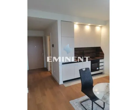 Modern kitchen with built-in cabinetry and a dining table. - image 8