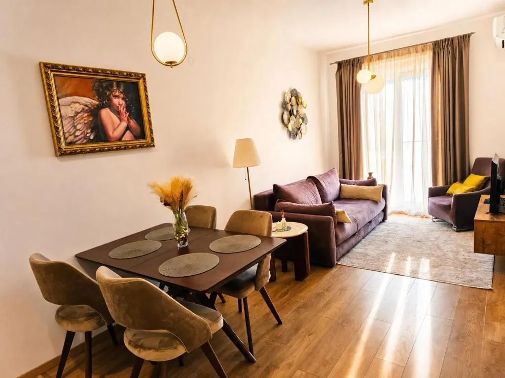 Living room with a dining area and comfortable furniture.