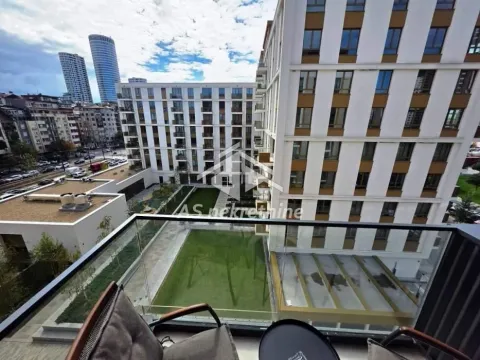 View from the balcony overlooking the building courtyard and surrounding structures. - image 12