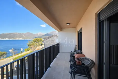 Covered balcony with seating furniture and sea view. - image 5