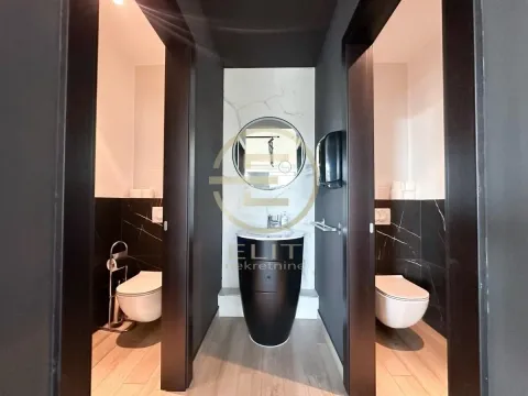 Modern restrooms with a washbasin and black-and-white ceramic tiles. - image 23