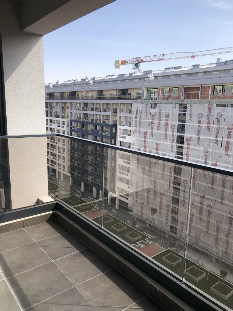 View from the balcony of neighboring residential buildings.