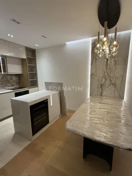 Modern kitchen with a kitchen island and dining table. - image 19
