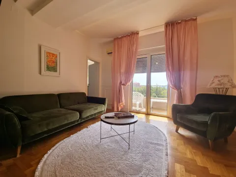 Living room with a sofa set, coffee table, and access to the terrace. - image 5