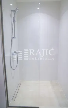 Modern shower cabin with a glass partition in the bathroom. - image 9