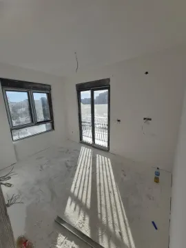 Empty room under construction with windows and balcony doors. - image 28
