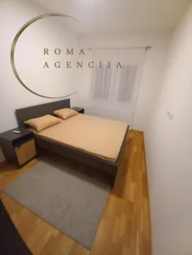 Furnished bedroom with a double bed. - image 7