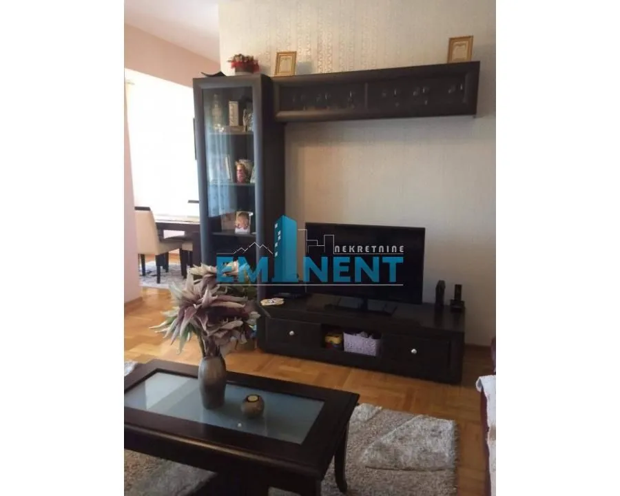 Living room with furniture and TV cabinet.
