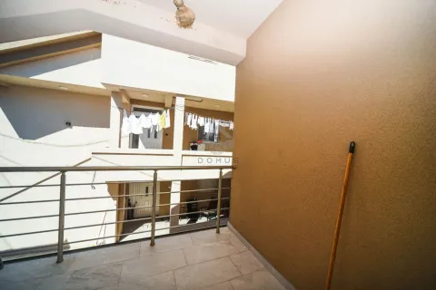 View from the tiled terrace with a metal railing and a broom in the corner. - image 6