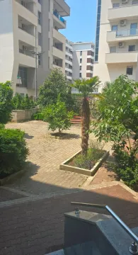 Inner courtyard of the building with greenery and palm trees. - image 9