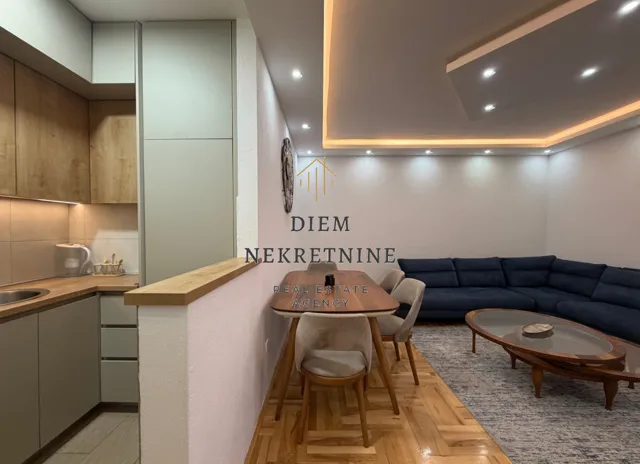 Living room connected to the dining area and kitchen.