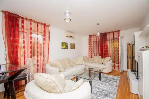 Bright living room with sofas and a glass table. - image 3