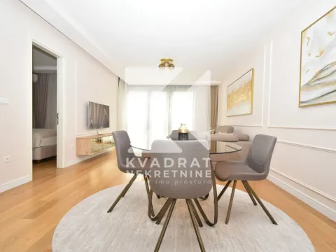 Living room with a dining area and access to the terrace. - image 3
