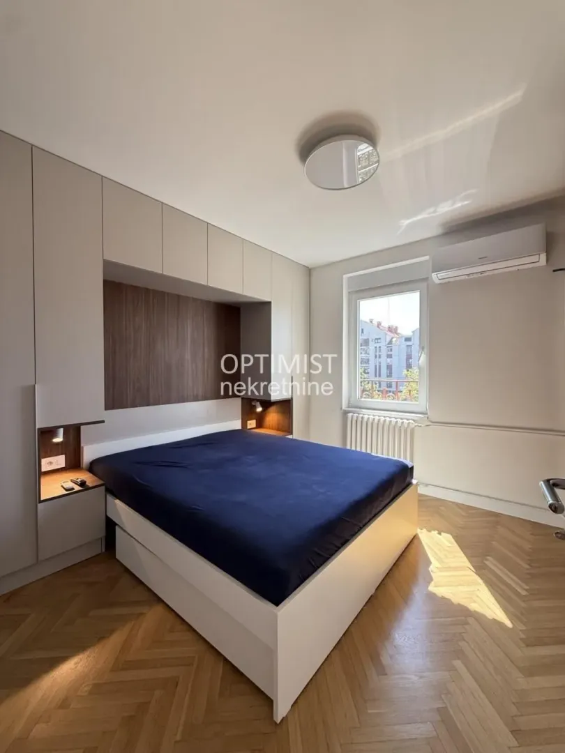 Bedroom with a double bed and fitted wardrobes.