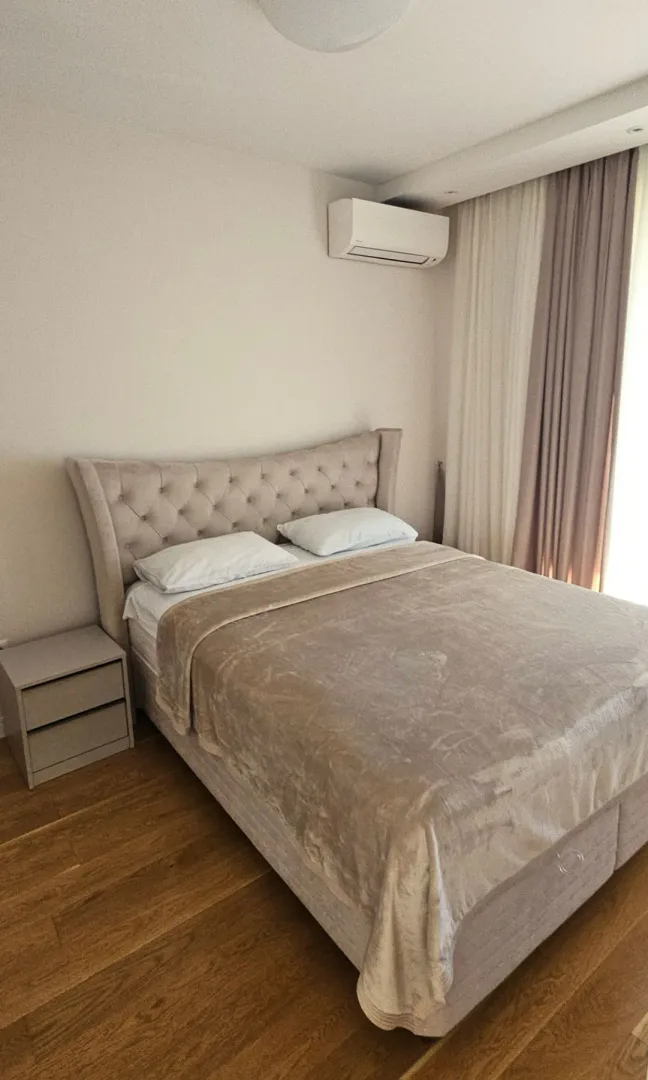 Bedroom with a double bed and a nightstand.