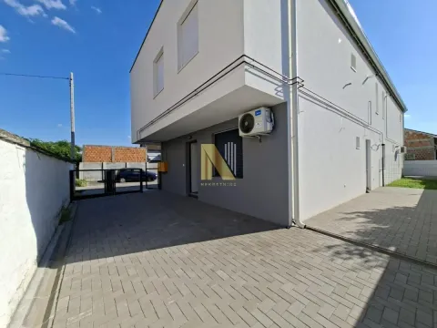 View of the exterior of the house with a paved courtyard and entrance. - image 9