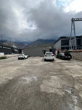 View of the exterior area of the property with a parking lot and mountains in the background. - image 7