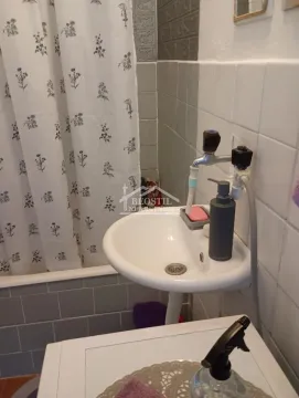 View of the bathroom with a sink and shower. - image 17