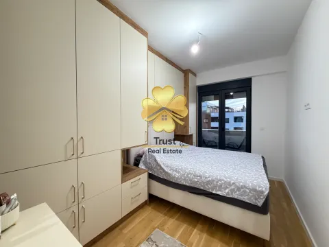 Furnished bedroom with a built-in wardrobe and a double bed. - image 13