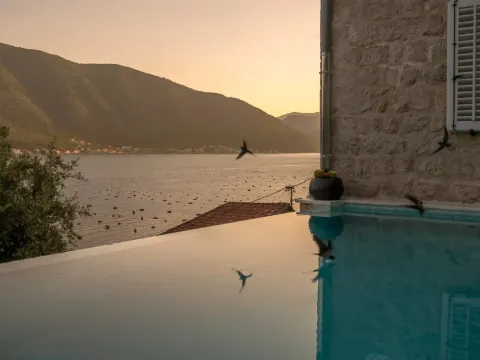 View of the pool, sea and mountains from the stone house terrace. - image 11