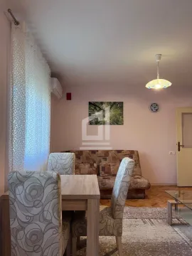 Living room with a sofa set and a dining table. - image 2