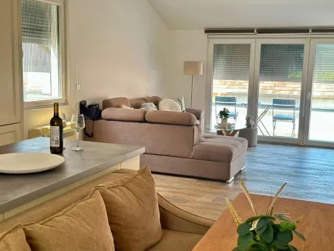 Living room with sofa, dining area, and access to the terrace. - image 5