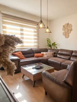 Comfortable living room with a corner sofa, coffee table, and decorative details. - image 8