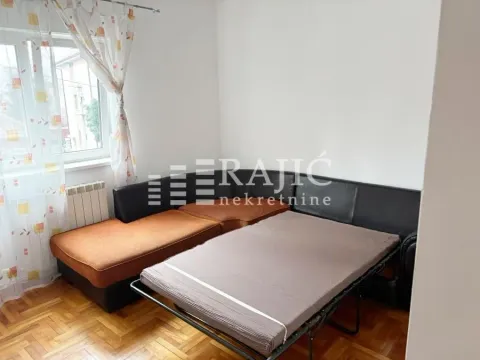 Living room with a sofa set and parquet flooring. - image 11