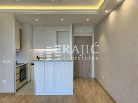Modern kitchen with a breakfast bar and built-in units. - image 5