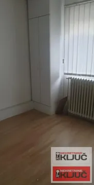Empty room with a built-in closet and wooden flooring. - image 6