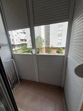 Enclosed balcony with a view of the courtyard. - image 4